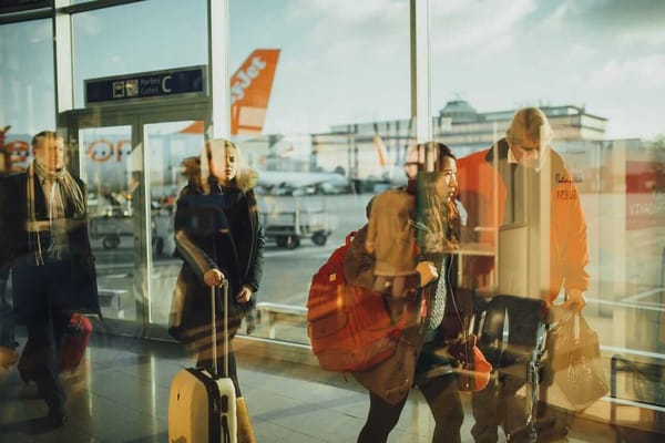 people are moving at the airport