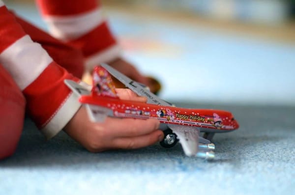 kid and toy airplane